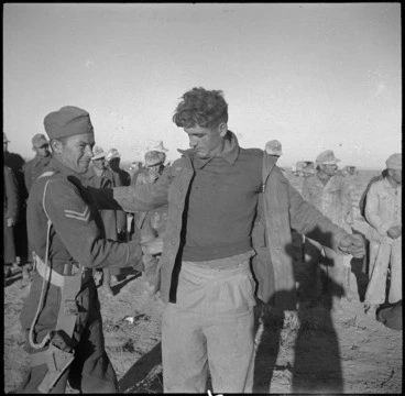 Image: NZ intelligence staff searching prisoners in the Western Desert, World War II