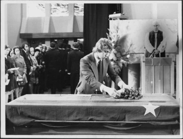 Image: John Kirk placing flowers on his father's casket during the state funeral of Prime Minister Norman Kirk at St Paul's Cathedral, Wellington