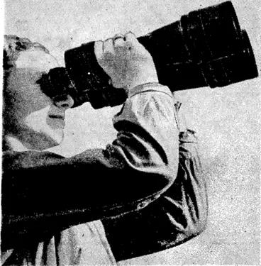 Image: Sport and General" Photo, With the growth of combative iveapons and the greater distance apart at which fighting forces noiv operate, the work of the official technician is more and more needed, especially to counter the greater use of camouflage. This picture was taken at a British.optical works engaged in military production, where an expert is seen testing a pair of the largest type of Admiralty binoculars* (Evening Post, 19 December 1939)