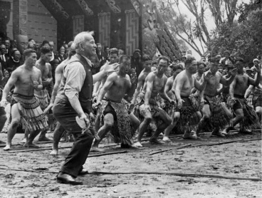 Image: Photograph of Apirana Ngata taking the lead in a haka on Waitangi Day at the centennial celebrations at Waitangi, taken by Bert Snowden