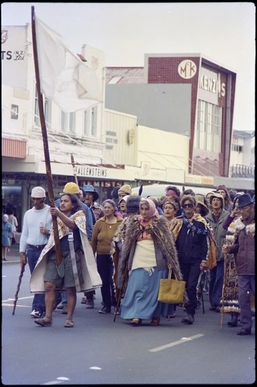 Image: Tame Iti holding pou whenua, accompanied by Whina Cooper, leading Maori Land March along Hamilton street