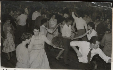 Image: Young men and women rock and roll dancing