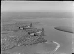 Two Royal New Zealand Air Force Airspeed Oxford aeroplanes in flight, over Auckland