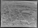 Newmarket Borough, Auckland City, view west showing Auckland Domain with Auckland Public Hospital and Park Road, Carlton Gore Road, Khyber Pass Road and Broadway, railway line, Auckland Grammar School, Herne Bay and harbour beyond