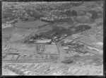 Mount Eden, Auckland, view over the Colonial Ammunition Company plant with shot tower next to The Kauri Timber Co Ltd, Normanby Road, with residential housing and Auckland Grammar School