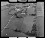 Glendowie, Auckland City, close-up view of Kerridge family home with tennis courts, ornamental gardens and greenhouses, surrounded by farmland, West Tamaki Road, Torea Nature Reserve beyond