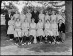 Unidentified members of a women's hockey team with their mascot and cup, probably Christchurch region