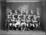 Studio portrait of members of an unidentified men's hockey team, with hockey sticks in the front, probably Christchurch district