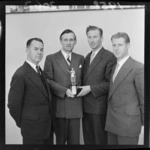 Members of the Wellington 22 Club debating team, which beat the Auckland team, with trophy