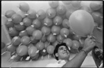 Scots College student with helium balloons - Photograph taken by Don Scott
