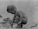 Marion Scott, playing on the beach