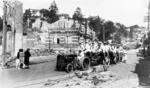 Naval personnel, involved in cleaning-up operations following the 1931 Napier Earthquake, shown at the bottom of Shakespeare Road, by the old Post Office and Lands and Deeds Offices, Napier
