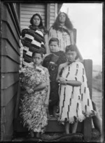 Ripeka Love with her children, alongside their house at Korokoro, Wellington