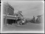 Queen Street East, Hastings, showing damaged Queen's Chambers building with with business of D Balharry, Land and Insurance agent and further down the Commercial Bank of Australia Ltd, probably after earthquake