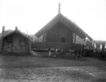 Maori pataka (storehouse) and raupo whare