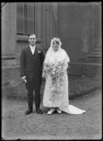 Outdoor wedding portrait of unidentified bridal couple outside St Paul's Presbyterian Church, Christchurch