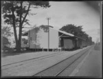 Exterior view of a freight rail wagons outside the goods shed at Hawkes Bay Fruitgrowers Federation sliding south of Hastings Station, Hawke's Bay District