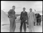 D Greig, left, with David Charteris and Harold Charteris, in front of a Auster Autocrat aeroplane, at RNZAC Pageant, Dunedin