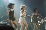 Tina Turner and dancers on stage at the Wellington Show and Sports Centre