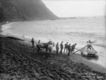 Beach between Cape Terawhiti and Sinclair Head, Wellington, with the raft used for recovering bodies after the wreck of the Penguin