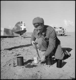 New Zealand engineer with dismantled mine in Tripolitania, Libya - Photograph taken by H Paton