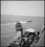 NZ reinforcements in lighter after disembarking from ship at Suez, World War II - Photograph taken by S Wemyss
