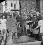Local women and girls filling containers at the local water pump in Bari, Italy - Photograph taken by G Kaye
