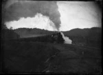 An "A" class steam locomotive with the Auckland to Wellington Express on the Raurimu Spiral, in 1909.