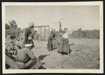Local woodchoppers cutting wood for troops, Zeitoun camp, Egypt