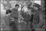 L G Bell and M D Elias in conversation with Italian peasant woman, World War II - Photograph taken by George Kaye