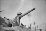 New Zealander A F Hare emerges from drivers compartment of a Sherman tank on the Italian Front, World War II - Photograph taken by George Kaye