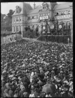 Part one of a two part panorama showing a welcome reception for New Zealand Governor, Lord Plunket, outside the Auckland Municipal Buildings