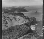 The Snow Rainger property on a headland with buildings, bush and steep cliffs north of Hatfield's Beach settlement, North Auckland, with the Hibiscus Coastal Highway and the Waiwera Hill Scenic Reserve