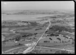 Development of the North Western motorway, Te Atatu, Auckland, with Auckland City in the background