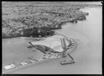 Westhaven, Auckland, showing the partial construction of the Auckland Harbour Bridge