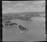 Toretore Island, Bay of Islands, includes; island, boats, bush, shoreline, bridge, roads and housing