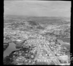 Whangarei, Northland, looking south to town with the Hatea River, Bank and Norfolk Streets and Rugby Park in foreground, with railway yards beyond