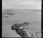 Kokinga Point with a residential house, bush and Kokinga Point Road, with Omakiwi Cove on the right and Whiorau Bay on the left, looking west to Te Rawhiti Inlet beyond, Bay of Islands, Northland