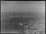 Auckland City and Harbour with Westhaven Marina Harbour Bridge construction site, to Devonport and Rangitoto Island beyond