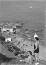 Woman and girl, in bathing costume, above the beach at Worser Bay, Wellington