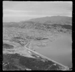 The head of Evans Bay with land reclamation work with power station, looking south to the suburbs of Rongotai and Miramar, Wellington City
