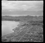 The head of Evans Bay with reclaimed land and power station, with the suburbs of Rongotai and Miramar beyond, Wellington City
