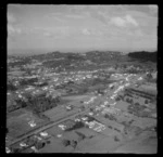 Aerial view of Prospect Road in Glen Eden, West Auckland, with Titirangi in the distance