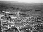 Simmonds Spartan biplane ZK-ABL over Dannevirke - Photograph taken by Newham's Photo Service