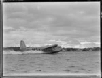 Short Empire flying boat 'Aotearoa' ZK-AMA, on an unidentified harbour