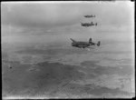 Three Lockheed Hudson aeroplanes, in flight, over an unidentified location