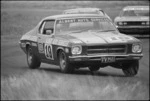 Holden Monaro competing in a car race