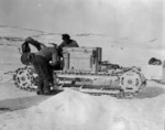 Bernard C Day and W Lashly fixing up one of the motor vehicles, Antarctica