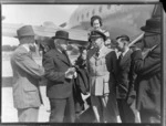 Fraser, Rt Hon Prime Minister at Whenuapai prior to departing for England by RAFTC [Royal Air Force Technical College], DC4 Aircraft. With L to R - E.A. Robinson Squadron Leader Adams, Mrs J. Kemp, Leo White and Rt Hon WJ Jordan