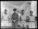 RNZAF survey flight to Japan, showing engineers, Flight Sergeant R Bird, Squadron Leader JR Torry, Flight Sergeant TR Smith, and Sergeant PB Marks, Whenuapai aerodrome, Auckland